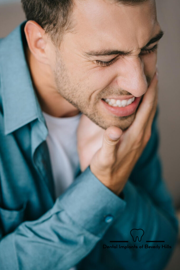 Man wincing because of toothache